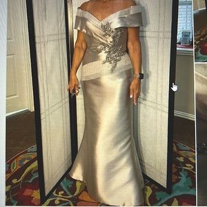 Terani Couture taupe color, long dress.  5’4 and wore 3inch heels for hem length
